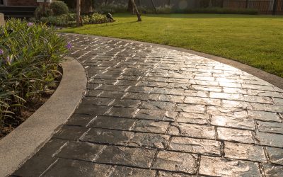 Stamped Concrete vs. Pavers: What’s Better for Your Backyard Makeover?
